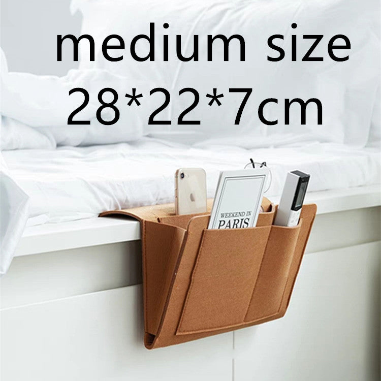 Felt bedside caddy beside a bed