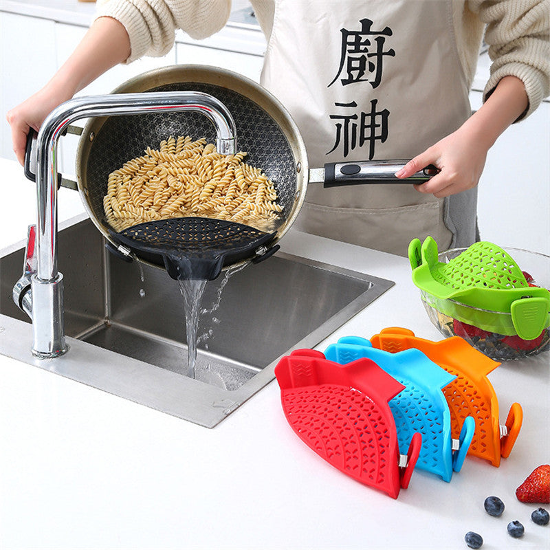 Clip-on strainer draining water from cookware